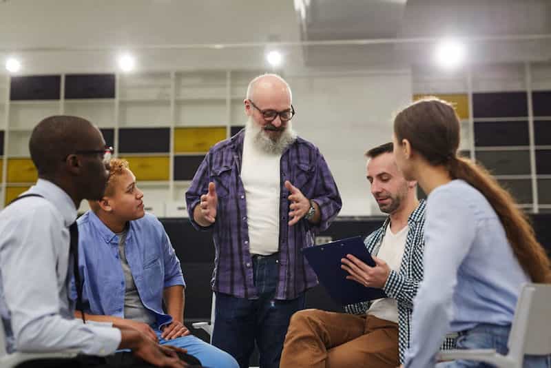 group of people practicing public speech